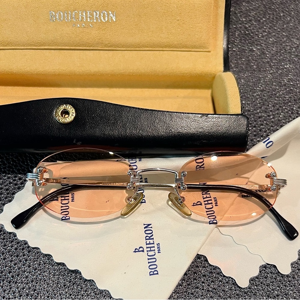 Boucheron Paris Authentic rimless glasses in soft peach with silver accents.